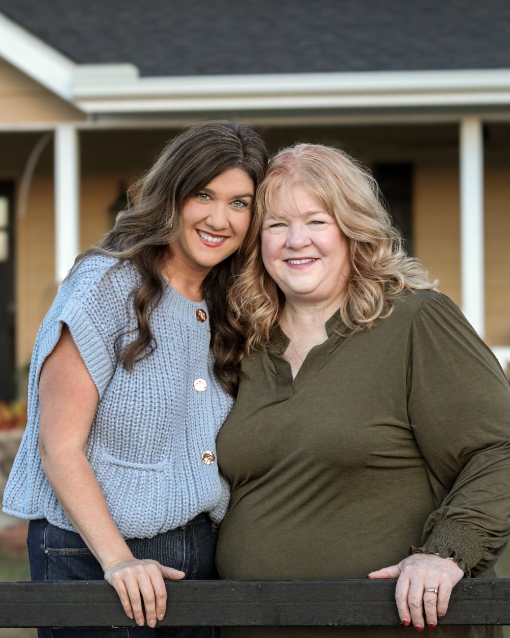 Momma and daughter together on the porch steps